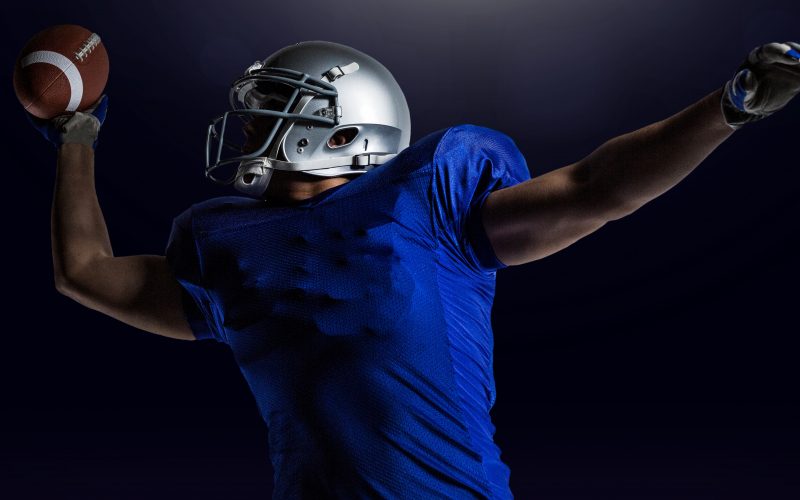 American football player catching ball - Sports & Entertainment Law
